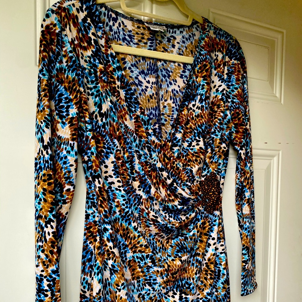 Knit dress,with faux wrap top. Wood clasp.